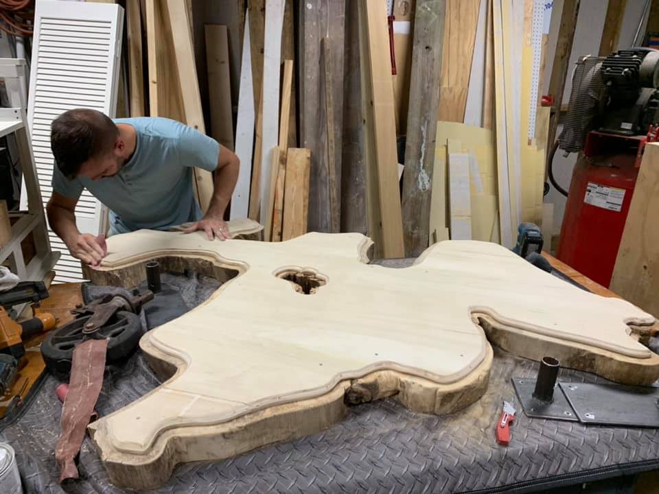 Photo of the sanding process of the custom-built Mysore fig wood coffe table